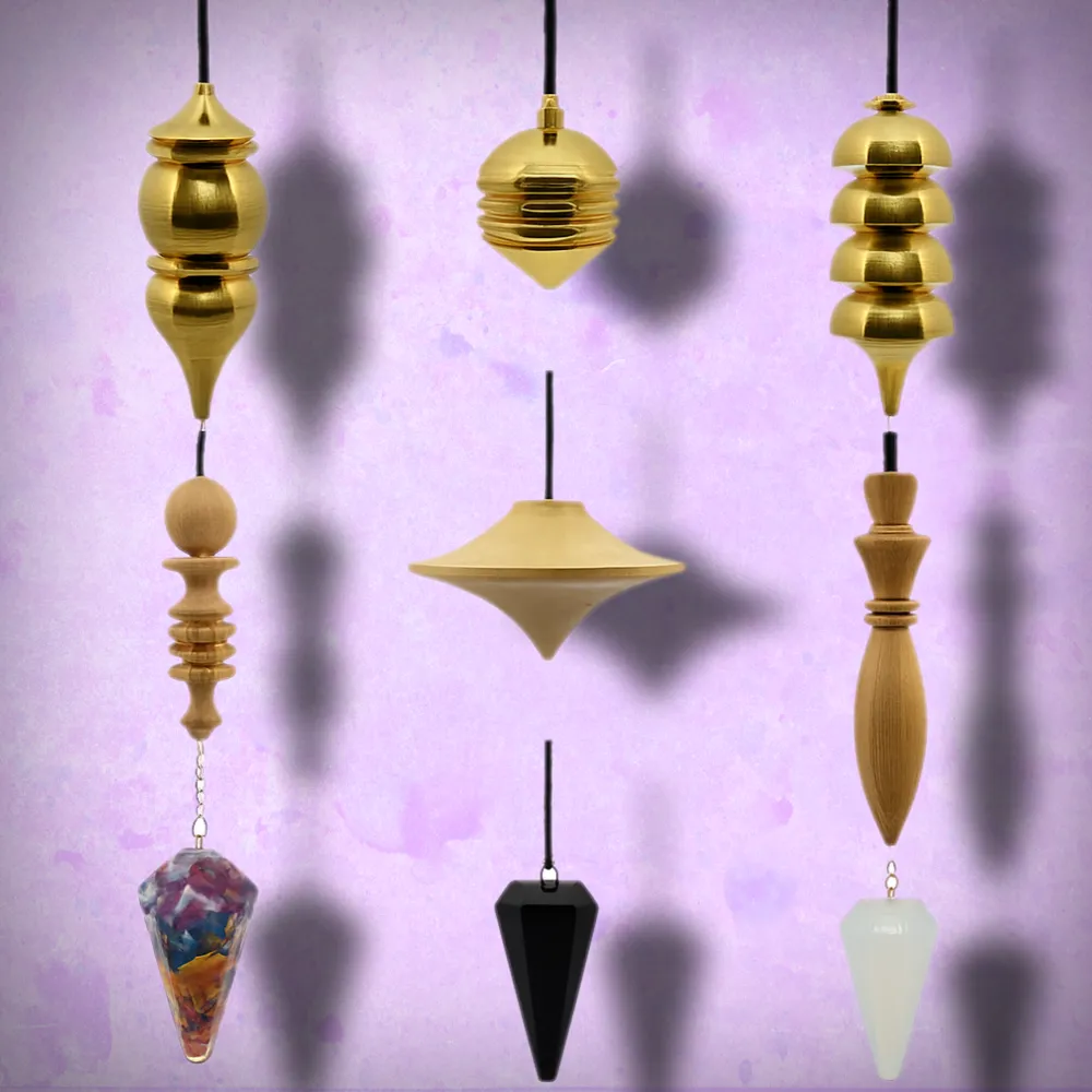 Understanding Pendulums and Dowsing Rods 3 Pendulum Display 2 - Brass, Wood and Crystal pendulums.